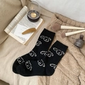 Simpatiche calze termiche nere con motivo a cani bianchi e morbida trama in cotone - Nero