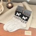 Calze spesse di lana beige con motivo a cucciolo nero e trama a maglia punteggiata - Taglia unica / Bianco