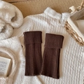 Dark brown ribbed knit leg warmers with folded cuffs in a cozy winter setting - One Size / Coffee