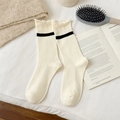Cream knit mid-calf socks with black stripes and ruffled cuffs for a cozy style - One Size / White
