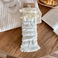 Witte gebreide beenwarmers met kant en strikjes, voorzien van een ruitpatroon - Crèmewit / Golftextuur