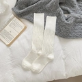 White crew socks with unique bubble textured knit and ribbed cuffs for a cozy look - One Size / White