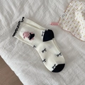 White crew socks featuring black ruffle trim, embroidered pink bunny and bows decoration - Black Top