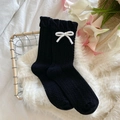 Sweet black ruffled crew socks featuring cable knit texture and white 3D bows - One Size / Black