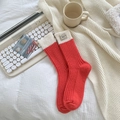 Chaussettes épaisses en laine rouge et crème avec étiquette tissée, ambiance cosy - Taille unique / Rouge Orangé