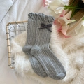 Grey knit crew socks featuring ruffle cuffs and a cute dark grey bow detail - One Size / Gray