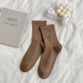 Brown crew socks with heart embroidery and ribbed texture in minimalist setup - One Size / Coffee