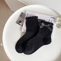 Calcetines negros japoneses con ribete de volantes y un lazo blanco con lunares - Talla única / Negro