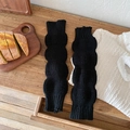Knitted leg warmers in black bubble knit texture for women's winter cozy style - One Size / Black
