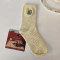 Chaussettes en tricot jaune clair mouchetées avec broderie florale blanche délicate - Taille unique / Jaune
