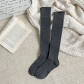 Dark grey ribbed knit high-thigh socks displayed on a cozy textured carpet setting - One Size / Dark Gray