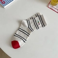 Cremefarbene Baumwollsocken mit schwarzen Streifen, Konfetti und HAPPY-Stickerei - HAPPY Buchstaben Gestreifter Stil (happy)
