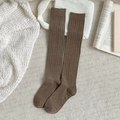 Deep brown ribbed knit knee-high socks in a cozy minimalist home aesthetic setting - One Size / Coffee