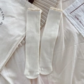 Creamy white ribbed socks for women featuring delicate beige lace trim and sweet style - Creamy White