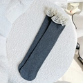 Grey rib-knit crew socks featuring white vintage lace trim, laid on a plush white mat - One Size / Gray