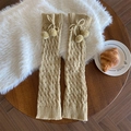 Beige Lolita cable knit leg warmers with cute pompom bows on a cozy plush background - One Size / Khaki