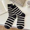 Classic black and white striped crew socks with elegant letter embroidery detail - One Size / Black