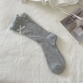 Light gray crew socks with ribbed texture, ruffled edges, and a white decorative bow - Grey (Blue Bow)