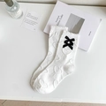 White JK style mid-calf socks with heart embossed texture and black satin bow accent - White Double Bow