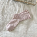 Pink speckled knit socks with feminine ruffled cuffs in a cozy aesthetic layout - Pink