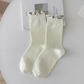 Beige ribbed knit crew socks featuring sweet ruffled edges with coffee contrast trim - Creamy White