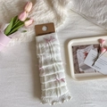 Creamy white knitted leg warmers with pink ribbon bows and heart texture patterns - One Size / White Base Pink Bow