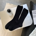 Women's black rib-knit mid-calf socks with breathable mesh texture and thick soft fabric - Black