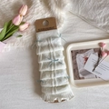 White knit leg warmers with blue ribbon bows and ruffled edges in balletcore style - One Size / White Green