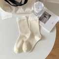 Creamy white ribbed mid-calf socks with ruffle trim and lace accents for women - One Size / Milk White