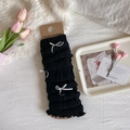 Black knit leg warmers with silver bow accents and ruffled edges in a layered slouchy style - One Size / Black Base Grey Bow