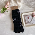 Black knitted leg warmers featuring purple glitter bows and ribbed texture details - One Size / Purple