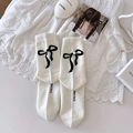 White ballet style socks featuring black bow print and pearl detail on lace background - One Size / White Base Black Bow