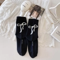 Japanese style black crew socks featuring elegant white ribbon bows and pearl details - One Size / Black with White