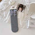 Grey ballet-style knit socks with delicate purple lace bows and striped texture - One Size / Ribbed Grey
