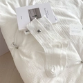 White crew socks with cute black bow embroidery and ruffled cuffs for sweet JK style - One Size / White