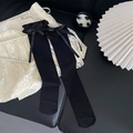 Bas noirs au-dessus du genou style Lolita avec dentelle à volants et nœud - Noir