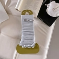 Light gray ballet style ribbed leg warmers with silver bow detail on display card - One Size / White