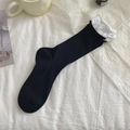 Calze da donna nere a coste con polsini bianchi a volant e design minimalista chic - Taglia unica / Nero
