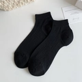 Women's minimalist black crew socks with classic vertical ribbed texture and elastic cuffs - One Size / Black