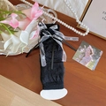 Lolita style black arm sleeves with white lace bows and elegant ribbed texture finish - One Size / Black