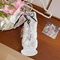 White lace leg warmers with black bow ribbons in a ballet-inspired aesthetic style - One Size / White