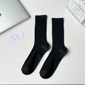 Minimalist black crew socks with classic vertical ribbed texture for daily wear - Fine Ribbed Black