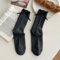 Dark gray crew socks with black ribbon bows and vertical ribbed texture knit - One Size / Dark Gray
