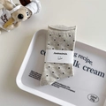 Japanese style gray polka dot socks with rolled cuffs on white tray with plush toy - Light Gray
