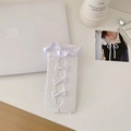 White lace calf socks with satin ruffles and elegant bow details in a flat lay view - One Size / White
