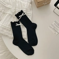 Japanese style black crew socks with ruffle edges and white bow accents for women - Black
