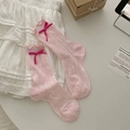 Pink openwork knit mid-calf socks with delicate ribbon bows and ruffled edges - Pink