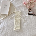 Elegant cream white lace leg covers with silk ribbon bows for a balletcore aesthetic - One Size / Beige