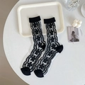 Elegant black floral lace socks with sheer mesh design for women in vintage style - Black