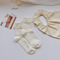 Creamy lace ruffle socks and matching bib set with vertical knit patterns for girls - One Size / Beige
